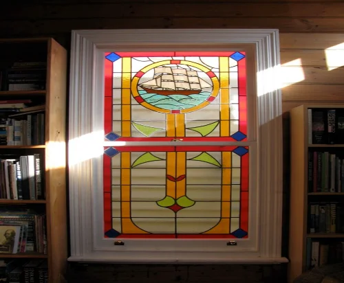 Stained glass window with wooden frame